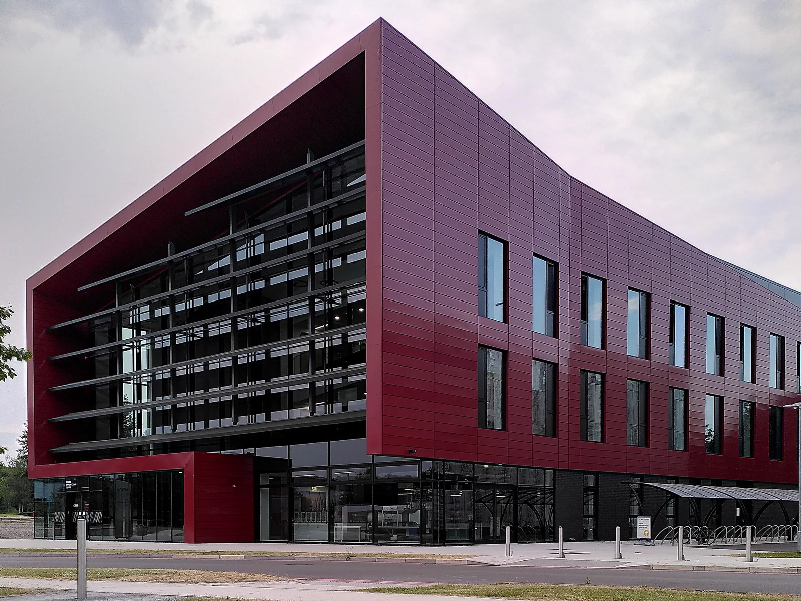 The red and black exterior of the WMG Degree Apprenticeship Centre at the University of Warwick.